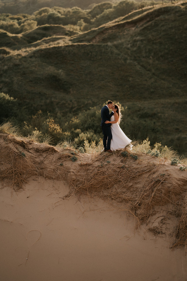 the couple connects on one of the sand dunes