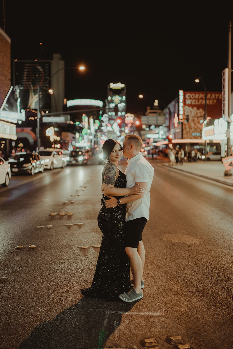 The couple have a photo in the middle of Las Vegas, in the road with lights in the background