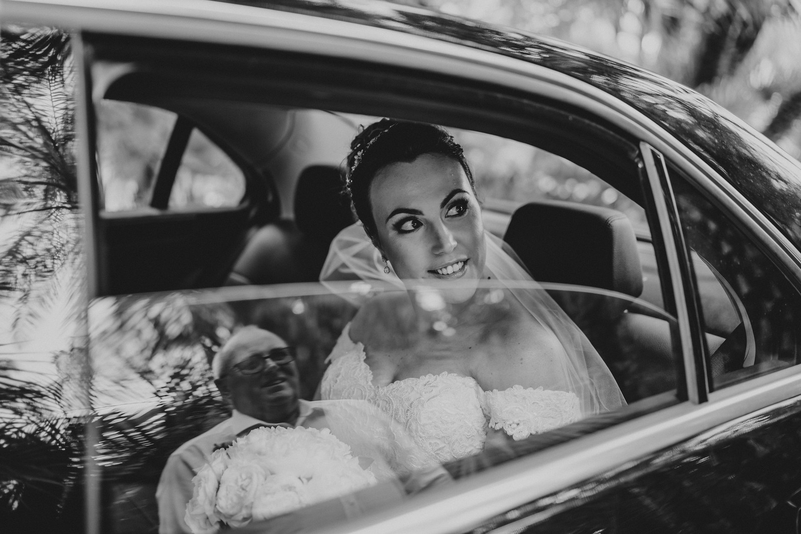Fathers reflection shown in the car window as bride looks out to her father| Wedding Photographer Near Me