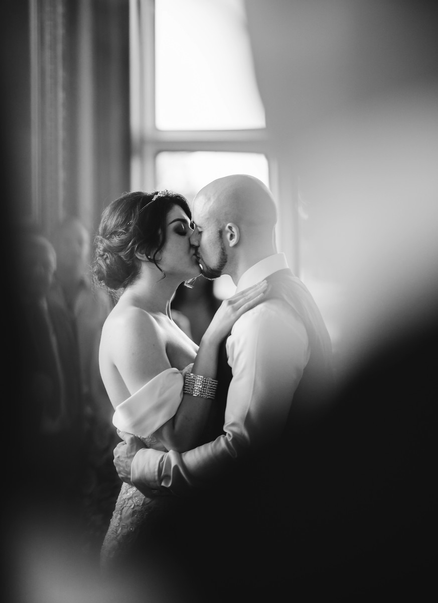 Bride and groom kiss wedding photo